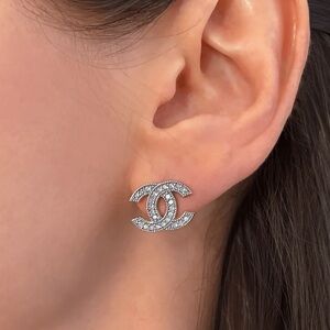 Absolutely stunning CC silver brand new  studs earrings with sparkly crystals .